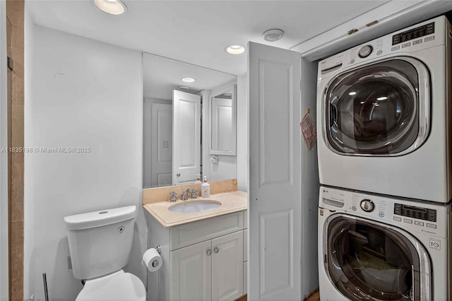 1600 S Bayshore Ln Unit 3A, Coconut Grove, FL 33133 - washroom with stacked washer and clothes dryer and recessed lighting