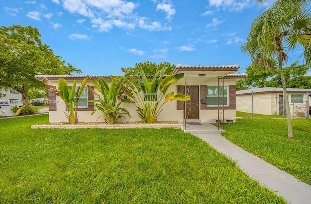 6044 Funston St, Hollywood, FL 33023 - mediterranean / spanish home with stucco siding and a front yard