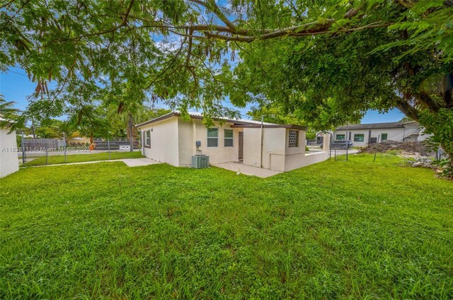 6044 Funston St, Hollywood, FL 33023 - back of house featuring stucco siding