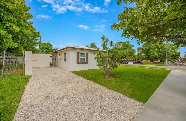 6044 Funston St, Hollywood, FL 33023 - view of front facade featuring stucco siding and driveway