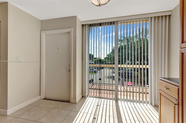 2921 SW 87th Ave Unit 511, Davie, FL 33328 - doorway with baseboards and light tile patterned floors