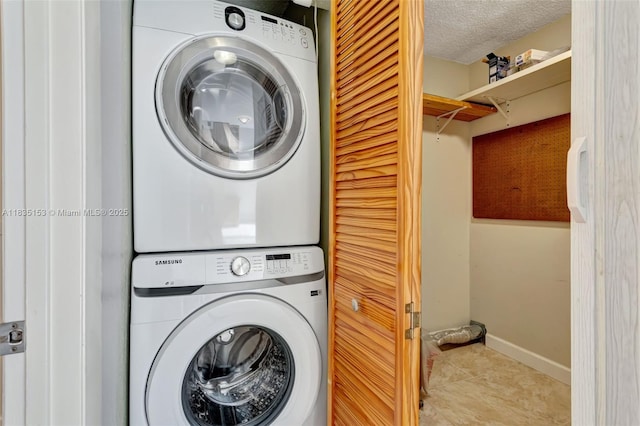2921 SW 87th Ave Unit 511, Davie, FL 33328 - laundry area featuring stacked washer / dryer, tile patterned flooring, and a textured ceiling