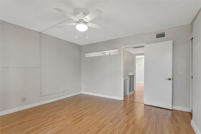 2921 SW 87th Ave Unit 511, Davie, FL 33328 - spare room featuring light wood finished floors, a ceiling fan, and a textured ceiling