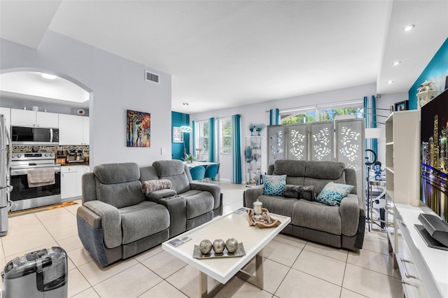 8956 W Flagler St Unit 203, Miami, FL 33174 - living room with arched walkways, light tile patterned floors, and recessed lighting