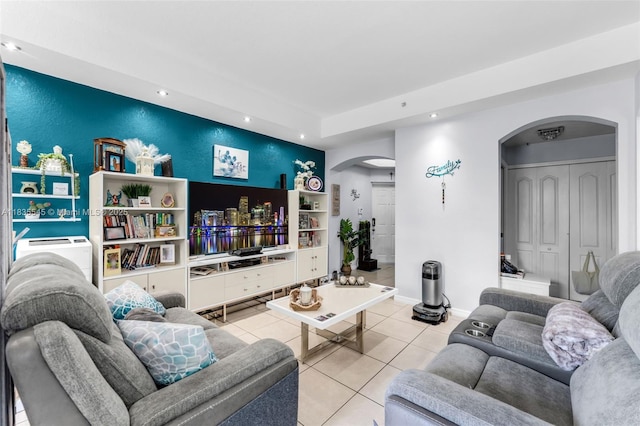 8956 W Flagler St Unit 203, Miami, FL 33174 - living room with arched walkways, light tile patterned floors, and recessed lighting