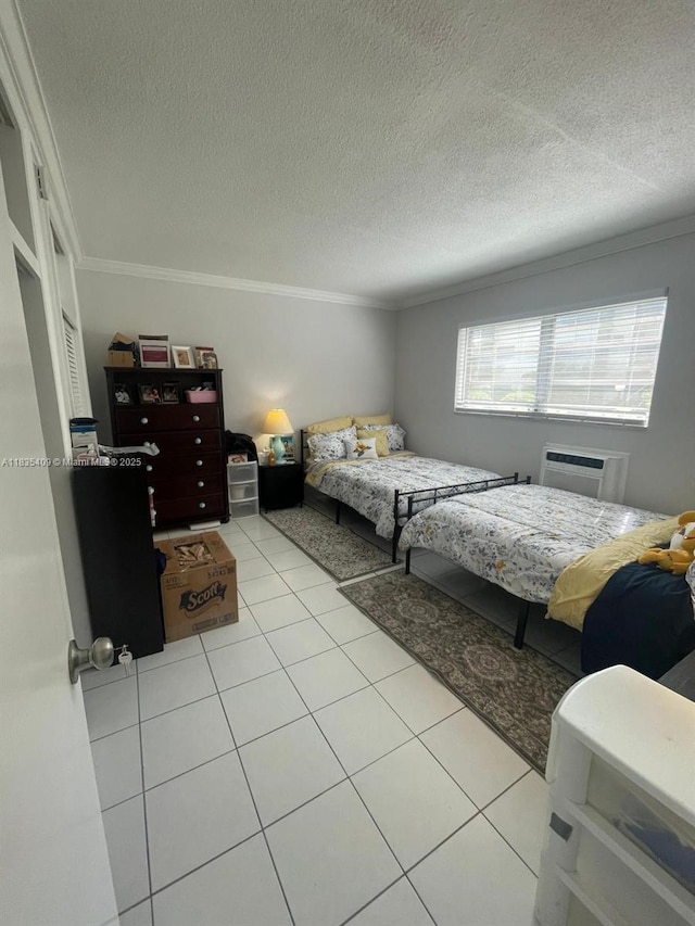 17000 NE 14th Ave Unit 109, Miami, FL 33162 - bedroom with crown molding, light tile patterned floors, a wall unit AC, and a textured ceiling