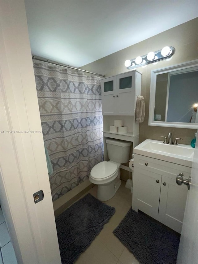 17000 NE 14th Ave Unit 109, Miami, FL 33162 - full bathroom with vanity, tile patterned flooring, and curtained shower