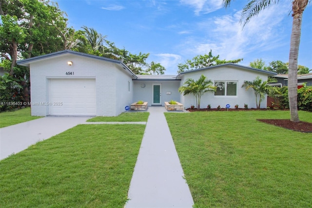 6541 SW 8th St, North Lauderdale, FL 33068 - ranch-style home with an attached garage, a front lawn, concrete driveway, and brick siding