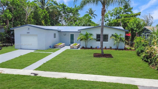 6541 SW 8th St, North Lauderdale, FL 33068 - ranch-style home featuring an attached garage, driveway, and brick siding