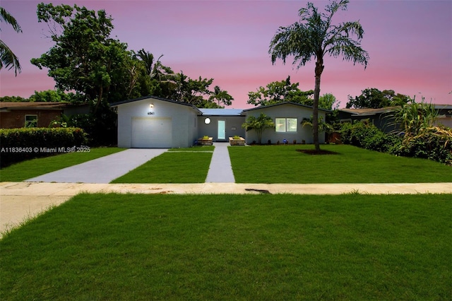 6541 SW 8th St, North Lauderdale, FL 33068 - ranch-style home featuring driveway, a front lawn, and an attached garage