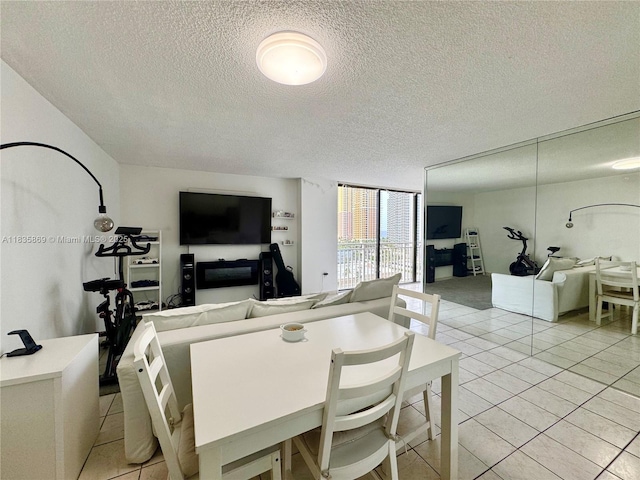 210 174th St Unit 1215, Sunny Isles Beach, FL 33160 - dining room featuring a textured ceiling and light tile patterned floors