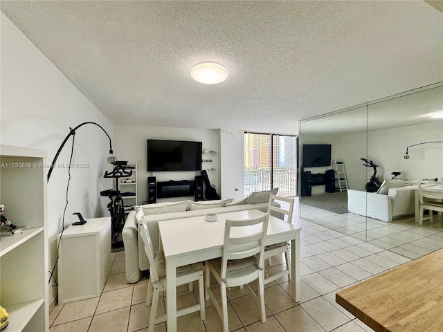 210 174th St Unit 1215, Sunny Isles Beach, FL 33160 - dining room featuring a textured ceiling, light tile patterned flooring, and floor to ceiling windows