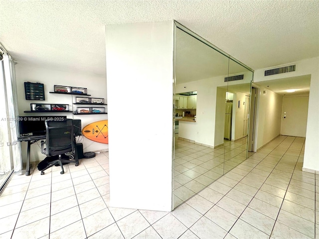 210 174th St Unit 1215, Sunny Isles Beach, FL 33160 - office area with light tile patterned flooring and a textured ceiling