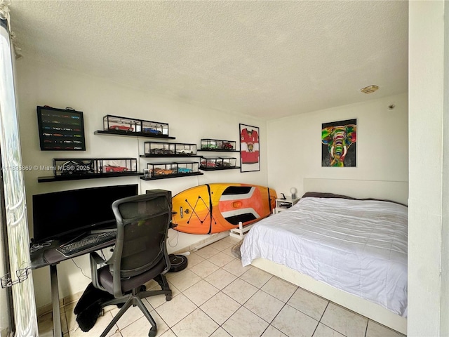 210 174th St Unit 1215, Sunny Isles Beach, FL 33160 - bedroom with tile patterned flooring, a textured ceiling, and an office area