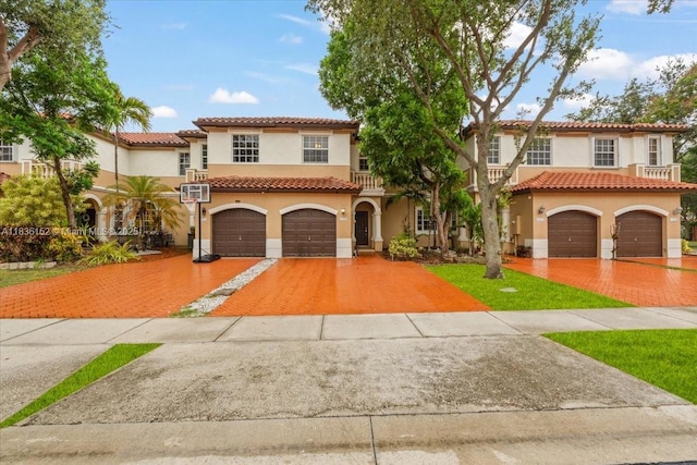 12720 SW 49th Ct, Miramar, FL 33027 - mediterranean / spanish house featuring stucco siding, decorative driveway, a garage, and a tile roof