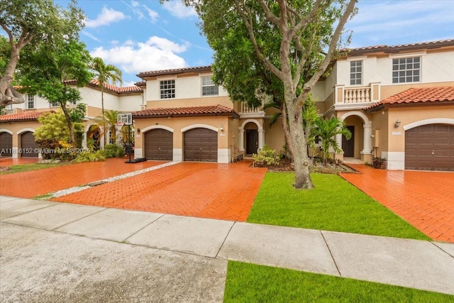 12720 SW 49th Ct, Miramar, FL 33027 - mediterranean / spanish house with driveway, stucco siding, a tiled roof, and a balcony