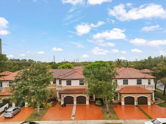12720 SW 49th Ct, Miramar, FL 33027 - mediterranean / spanish house with stucco siding, a tiled roof, and driveway
