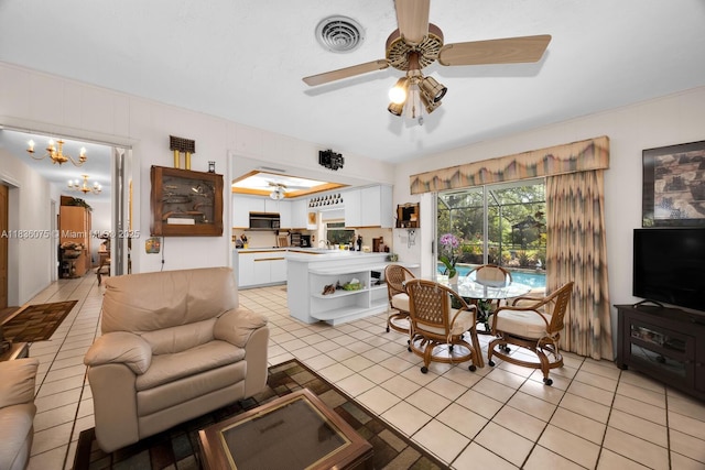 15340 SW 82nd Ave, Palmetto Bay, FL 33157 - living area featuring a ceiling fan, light tile patterned floors, and a chandelier