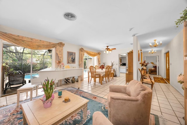 15340 SW 82nd Ave, Palmetto Bay, FL 33157 - living room with tile patterned flooring, a chandelier, and ceiling fan
