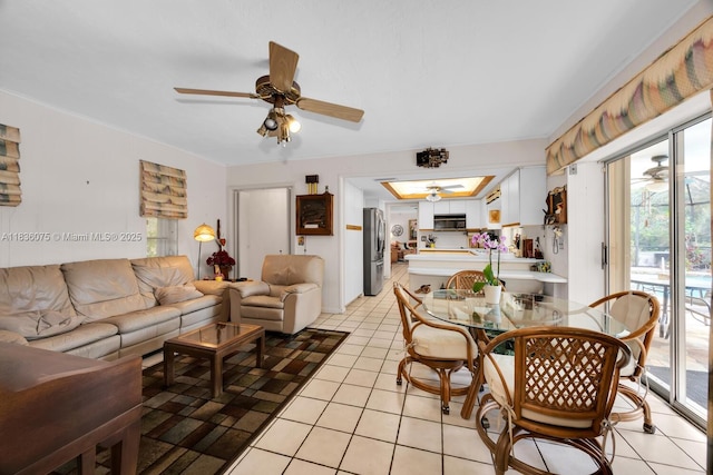 15340 SW 82nd Ave, Palmetto Bay, FL 33157 - living area with ceiling fan, plenty of natural light, and light tile patterned floors