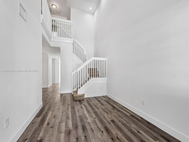 1456 SE 26th Ave, Homestead, FL 33035 - unfurnished living room with wood finished floors, a high ceiling, and stairs