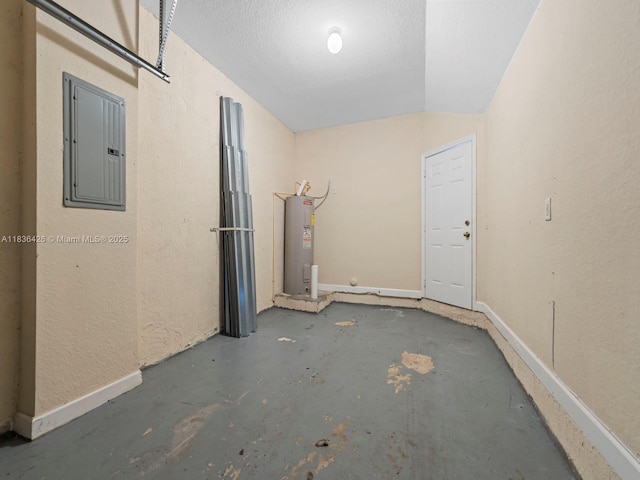 1456 SE 26th Ave, Homestead, FL 33035 - spare room with electric panel, electric water heater, and concrete floors
