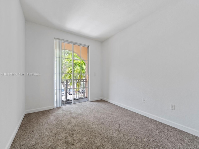 1456 SE 26th Ave, Homestead, FL 33035 - spare room featuring carpet floors and baseboards