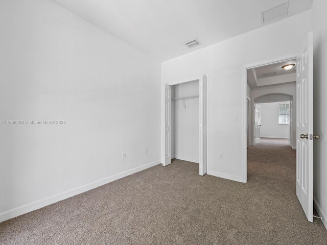 1456 SE 26th Ave, Homestead, FL 33035 - unfurnished bedroom featuring carpet flooring, arched walkways, a closet, and vaulted ceiling