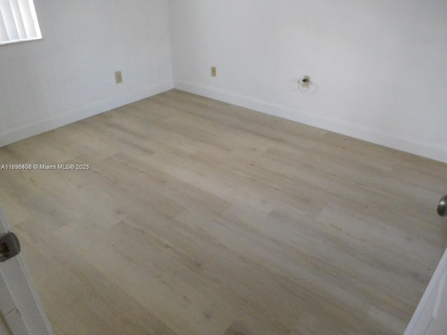 323 Ives Dairy Rd Unit 323-06, Miami, FL 33179 - empty room with wood finished floors and baseboards