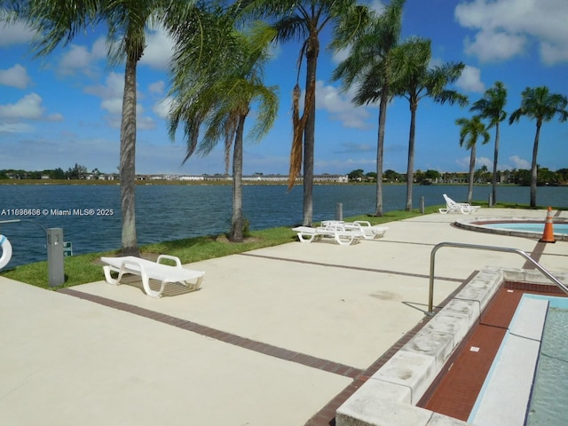 323 Ives Dairy Rd Unit 323-06, Miami, FL 33179 - view of property's community featuring a pool, a patio area, and a water view