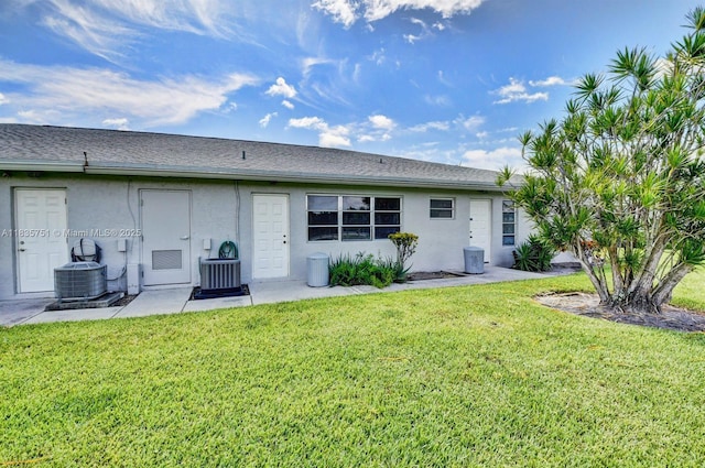 14529 Canalview Dr Unit B, Delray Beach, FL 33484 - back of property with a yard, stucco siding, and a patio area