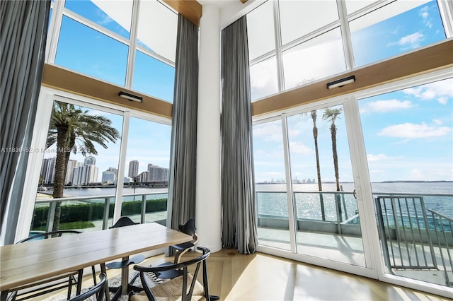 1331 Brickell Bay Dr Unit Bl-21, Miami, FL 33131 - dining space with a water view, a towering ceiling, and a skyline view