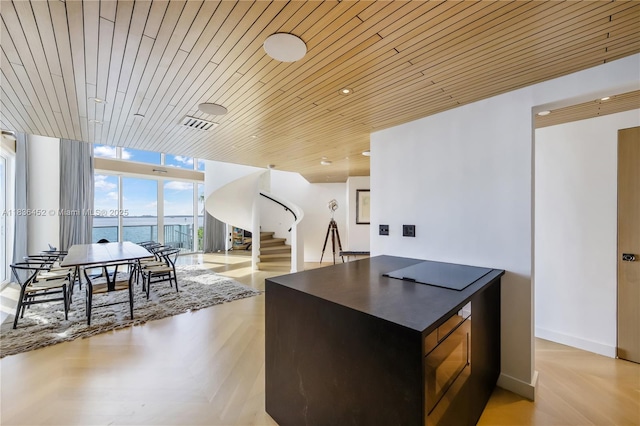 1331 Brickell Bay Dr Unit Bl-21, Miami, FL 33131 - kitchen featuring dark countertops, expansive windows, and wooden ceiling