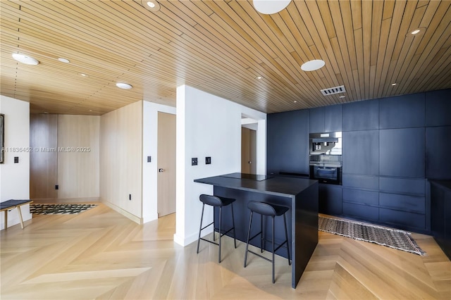 1331 Brickell Bay Dr Unit Bl-21, Miami, FL 33131 - kitchen with dark countertops, a kitchen breakfast bar, recessed lighting, a peninsula, and modern cabinets