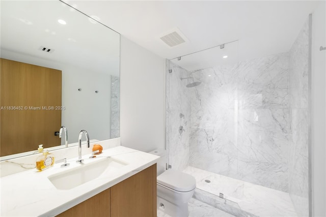 1331 Brickell Bay Dr Unit Bl-21, Miami, FL 33131 - bathroom featuring vanity, a marble finish shower, and marble finish flooring