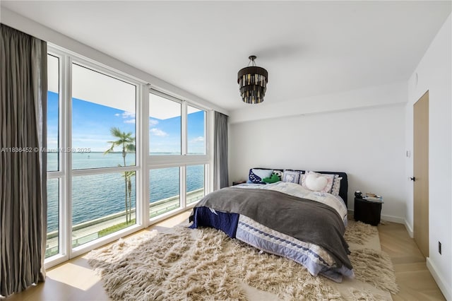 1331 Brickell Bay Dr Unit Bl-21, Miami, FL 33131 - bedroom featuring a water view and a chandelier