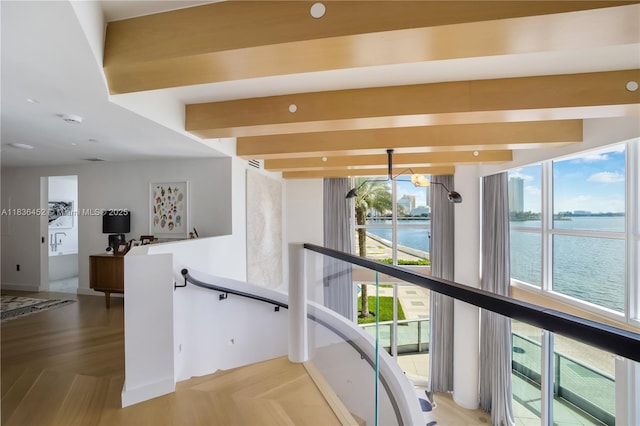 1331 Brickell Bay Dr Unit Bl-21, Miami, FL 33131 - hallway with an upstairs landing, a chandelier, a water view, and light wood-style floors