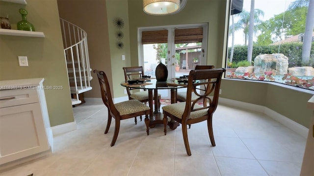 9099 NW 47th Ct, Coral Springs, FL 33067 - dining room featuring stairs and light tile patterned flooring