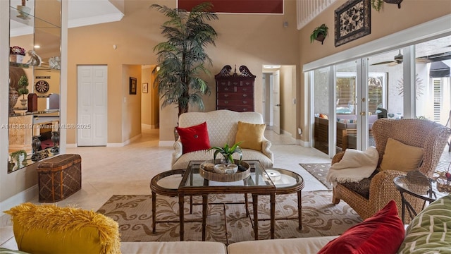 9099 NW 47th Ct, Coral Springs, FL 33067 - living area featuring a high ceiling, crown molding, tile patterned floors, a ceiling fan, and french doors