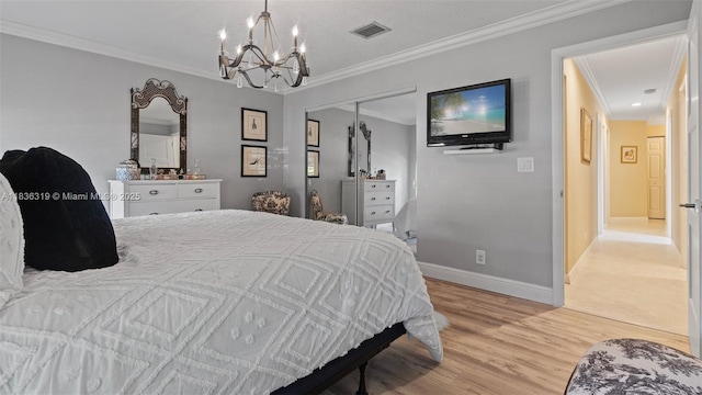 9099 NW 47th Ct, Coral Springs, FL 33067 - bedroom featuring a chandelier, ornamental molding, light wood-style flooring, and a closet