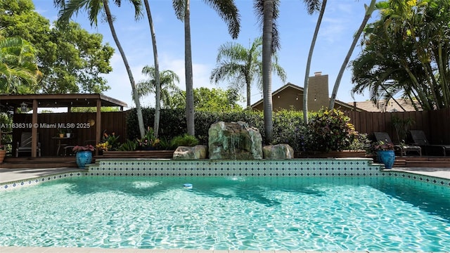 9099 NW 47th Ct, Coral Springs, FL 33067 - view of pool featuring a fenced backyard