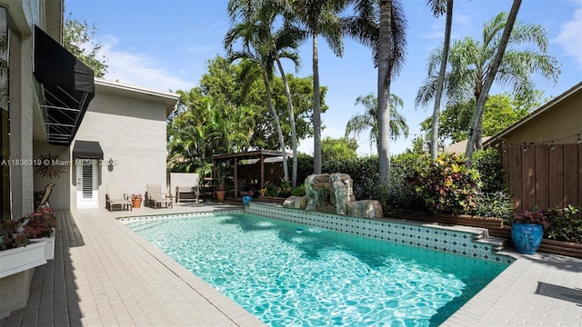 9099 NW 47th Ct, Coral Springs, FL 33067 - view of pool with a gazebo and a fenced backyard