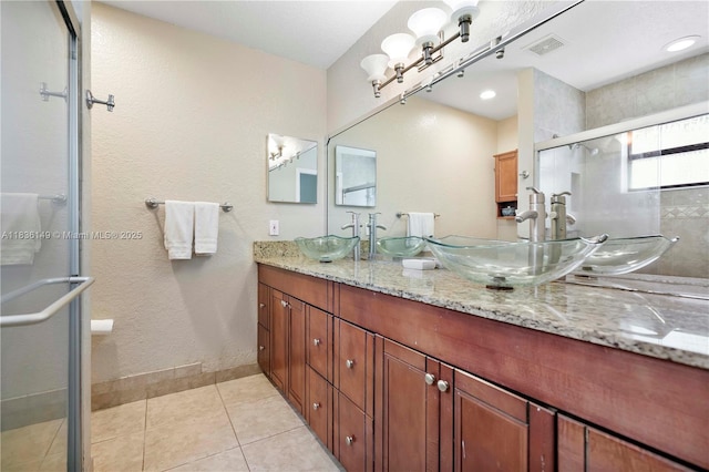 8250 NW 51st Ct, Lauderhill, FL 33351 - bathroom featuring double vanity, a shower stall, and tile patterned floors