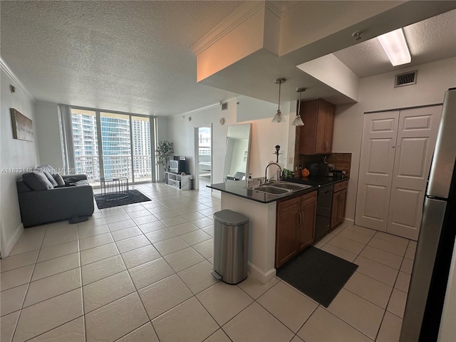 2000 N Bayshore Dr Unit 1505, Miami, FL 33137 - kitchen featuring open floor plan, dark countertops, a textured ceiling, a peninsula, and light tile patterned floors