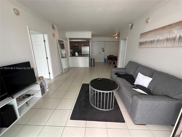 2000 N Bayshore Dr Unit 1505, Miami, FL 33137 - living area featuring ornamental molding, a textured ceiling, and tile patterned flooring