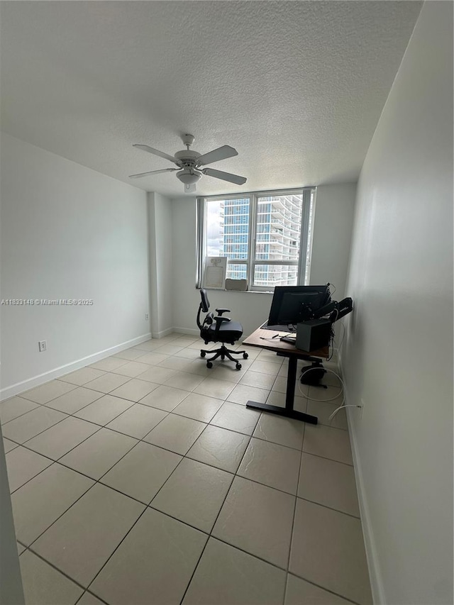 2000 N Bayshore Dr Unit 1505, Miami, FL 33137 - living area with light tile patterned floors, a textured ceiling, a desk, and a ceiling fan