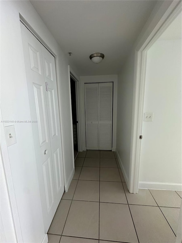 2000 N Bayshore Dr Unit 1505, Miami, FL 33137 - hall featuring light tile patterned flooring and baseboards