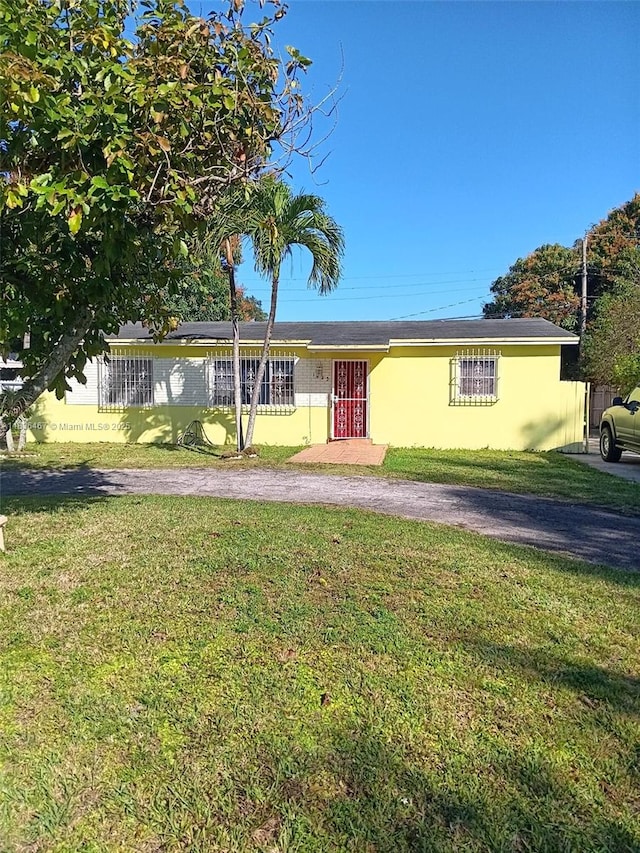 1825 NW 112th St, Miami, FL 33167 - single story home featuring a front yard and stucco siding