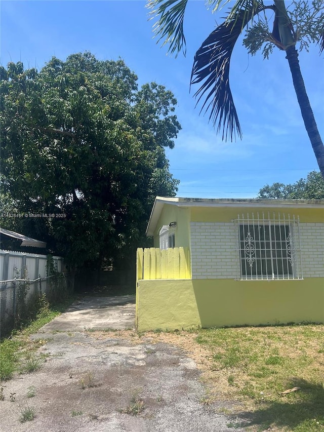 1825 NW 112th St, Miami, FL 33167 - view of side of property with brick siding