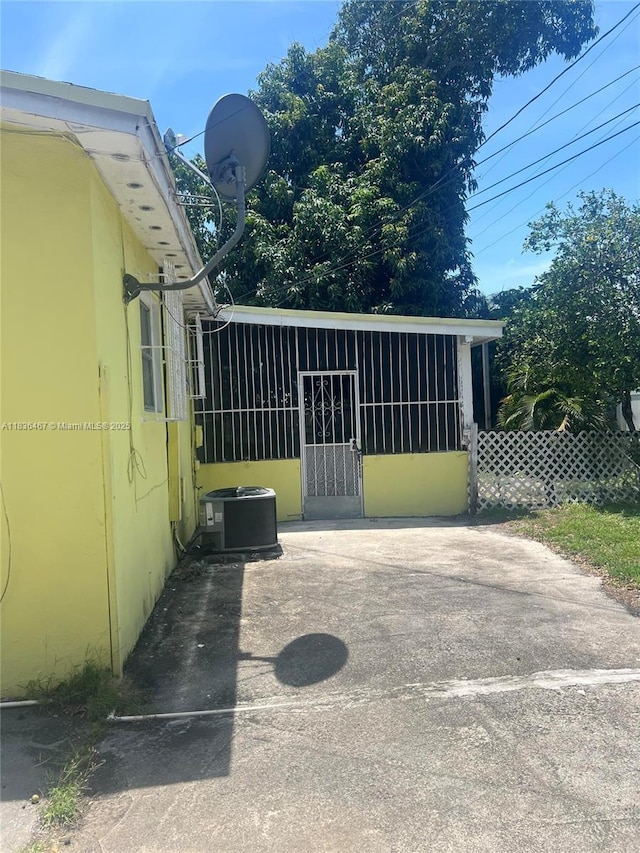1825 NW 112th St, Miami, FL 33167 - view of property exterior featuring a central AC unit